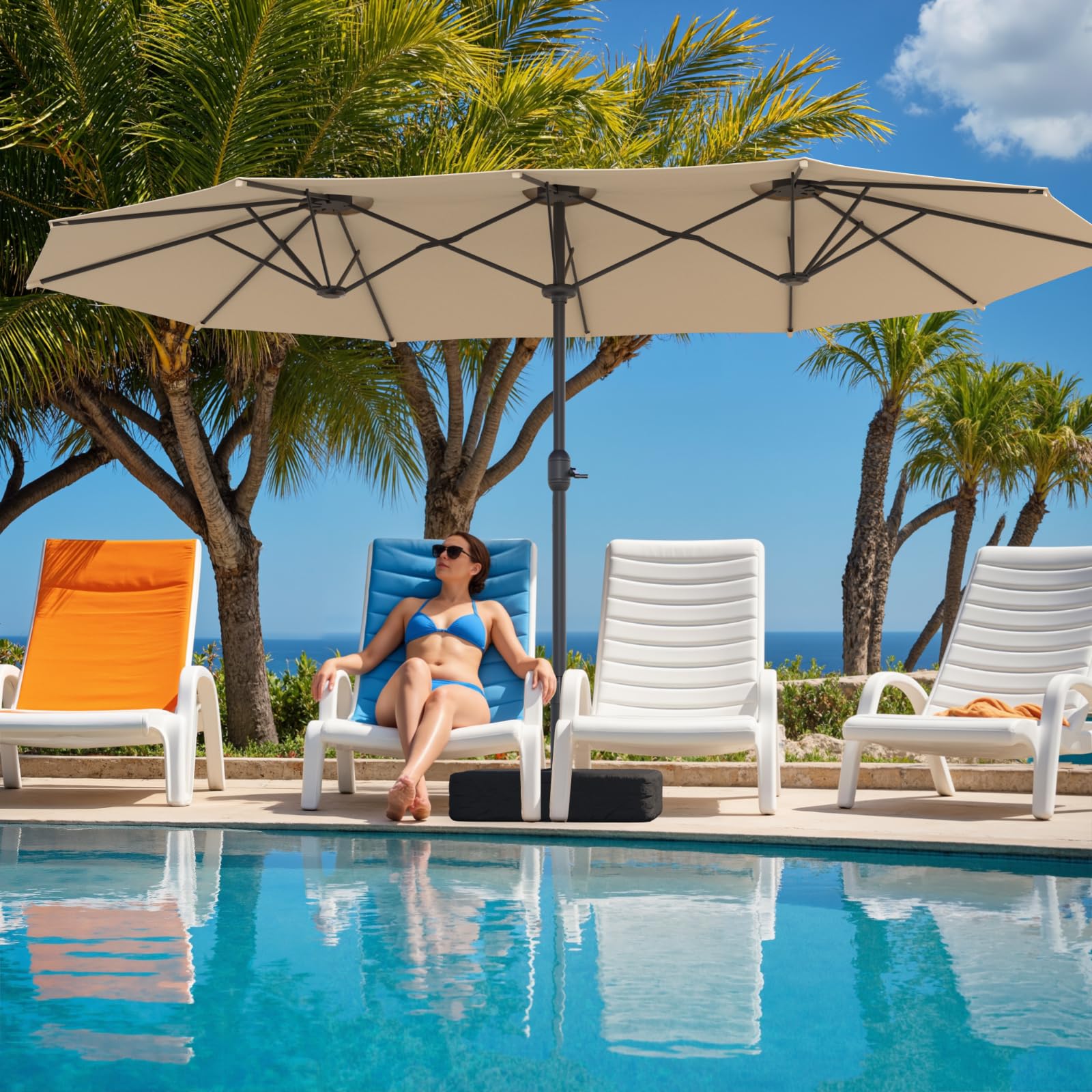Sannwsg poolside scene showing umbrella creating cool shaded lounging area
