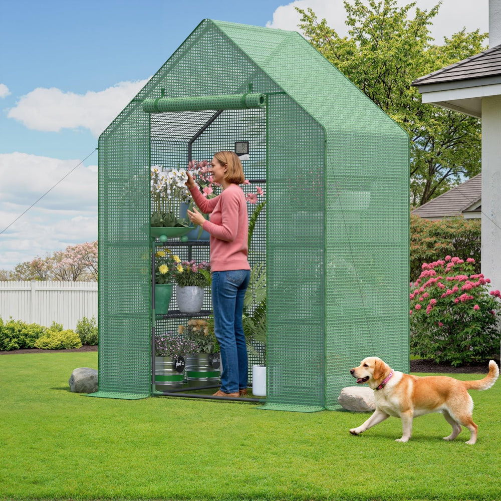Sannwsg scale view with gardener beside greenhouse showing full-size clearance