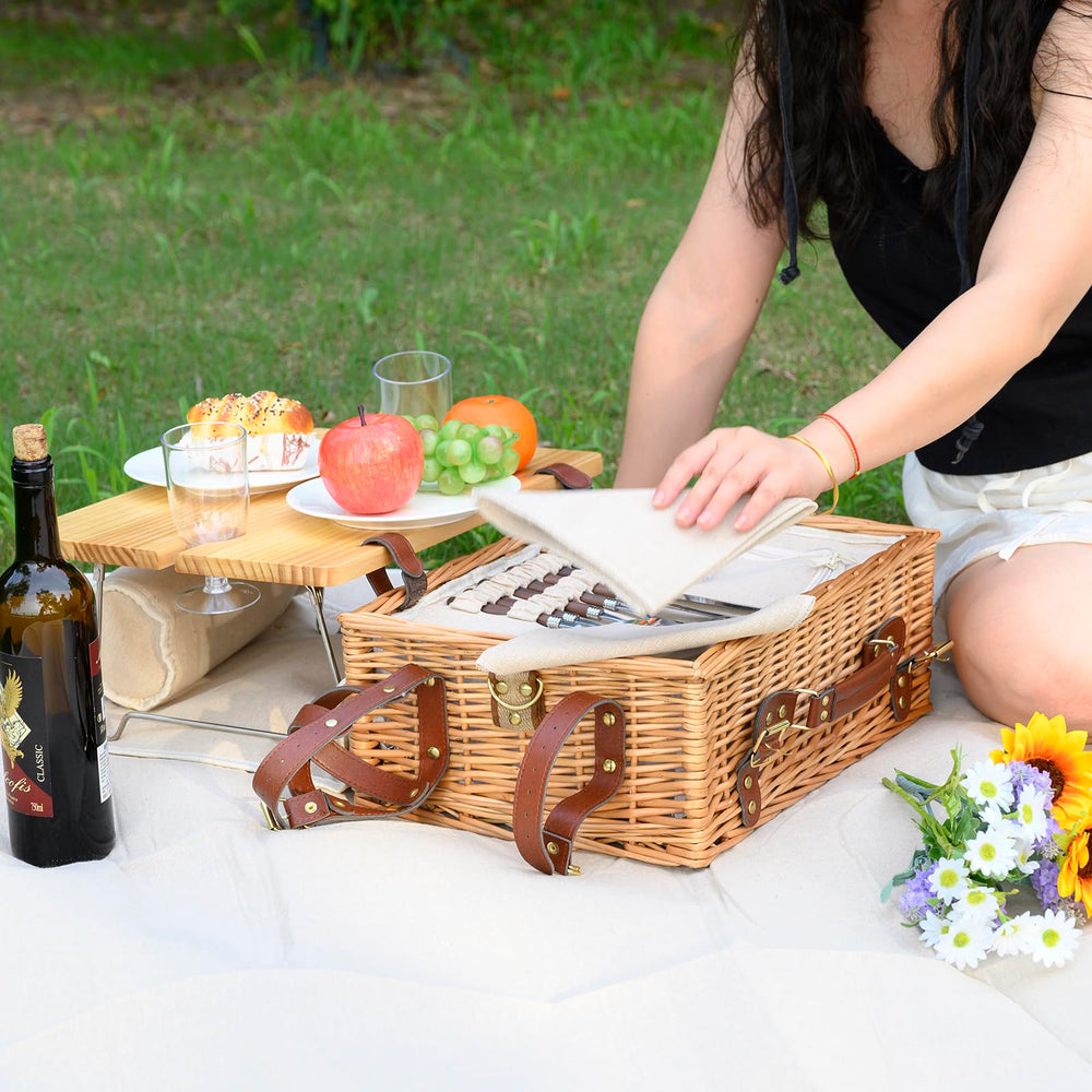 SatisInside couple enjoying picnic showing complete kit enabling relaxed outdoor meals
