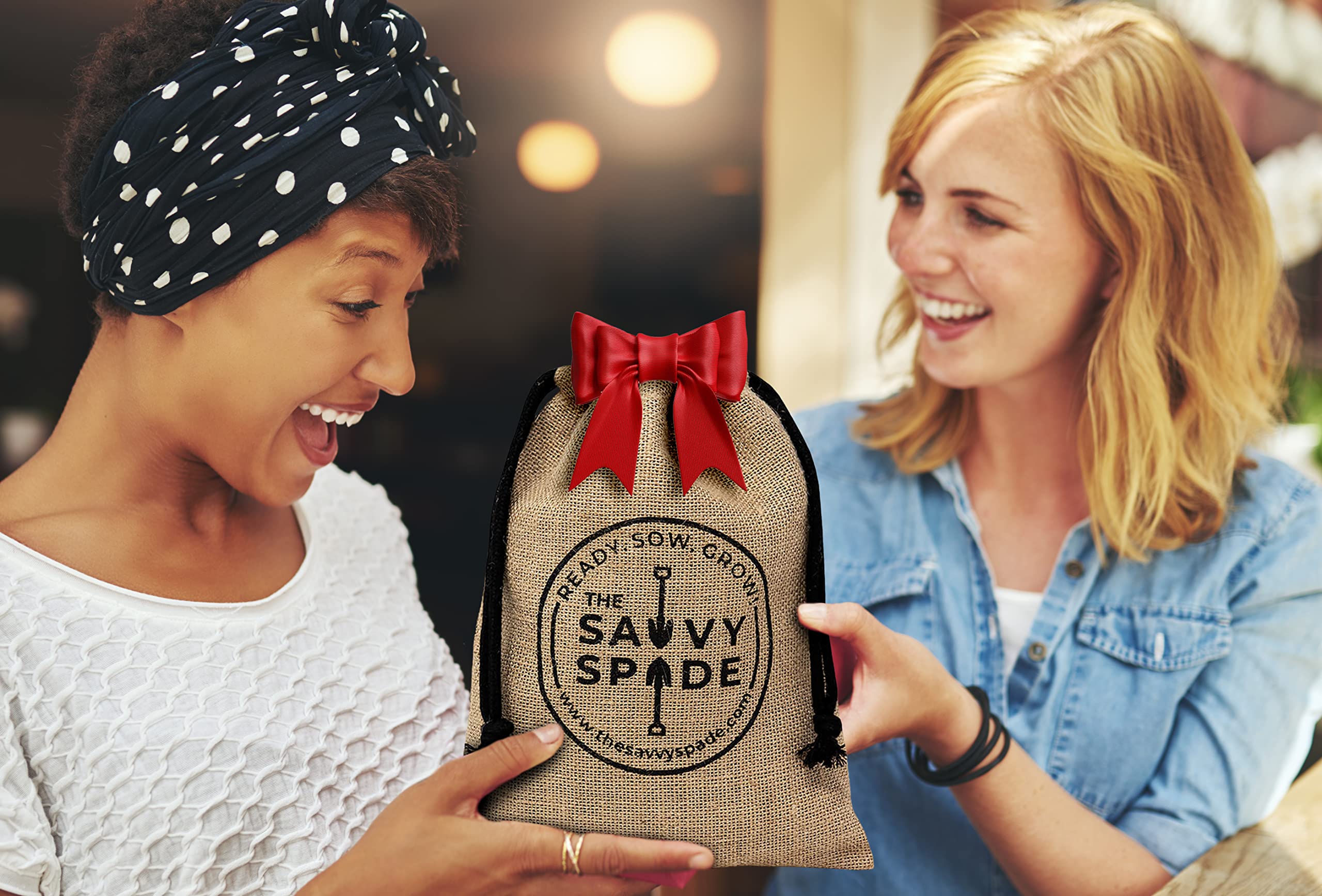 The Savvy Spade close-up of four seed packets highlighting non-GMO heirloom varieties and clarity