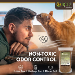 SCD Probiotics sprinkled into a kitchen composter demonstrating odor reduction and easy daily use