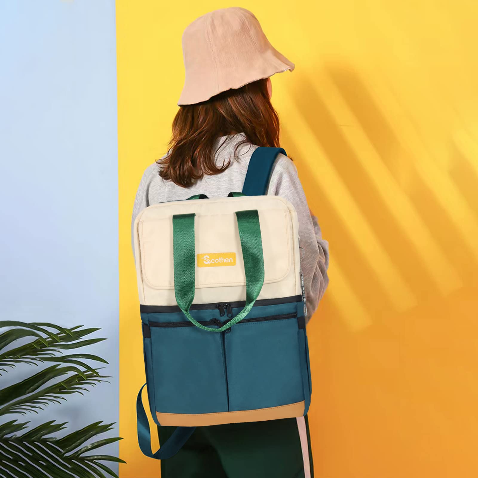 Scothen beside a suitcase to show scale and trolley sleeve ease for travel