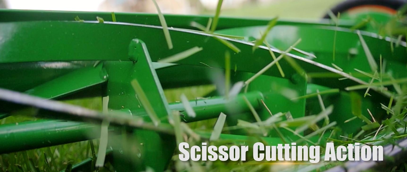 Scotts mower beside shoe showing compact size and lightweight handling benefit