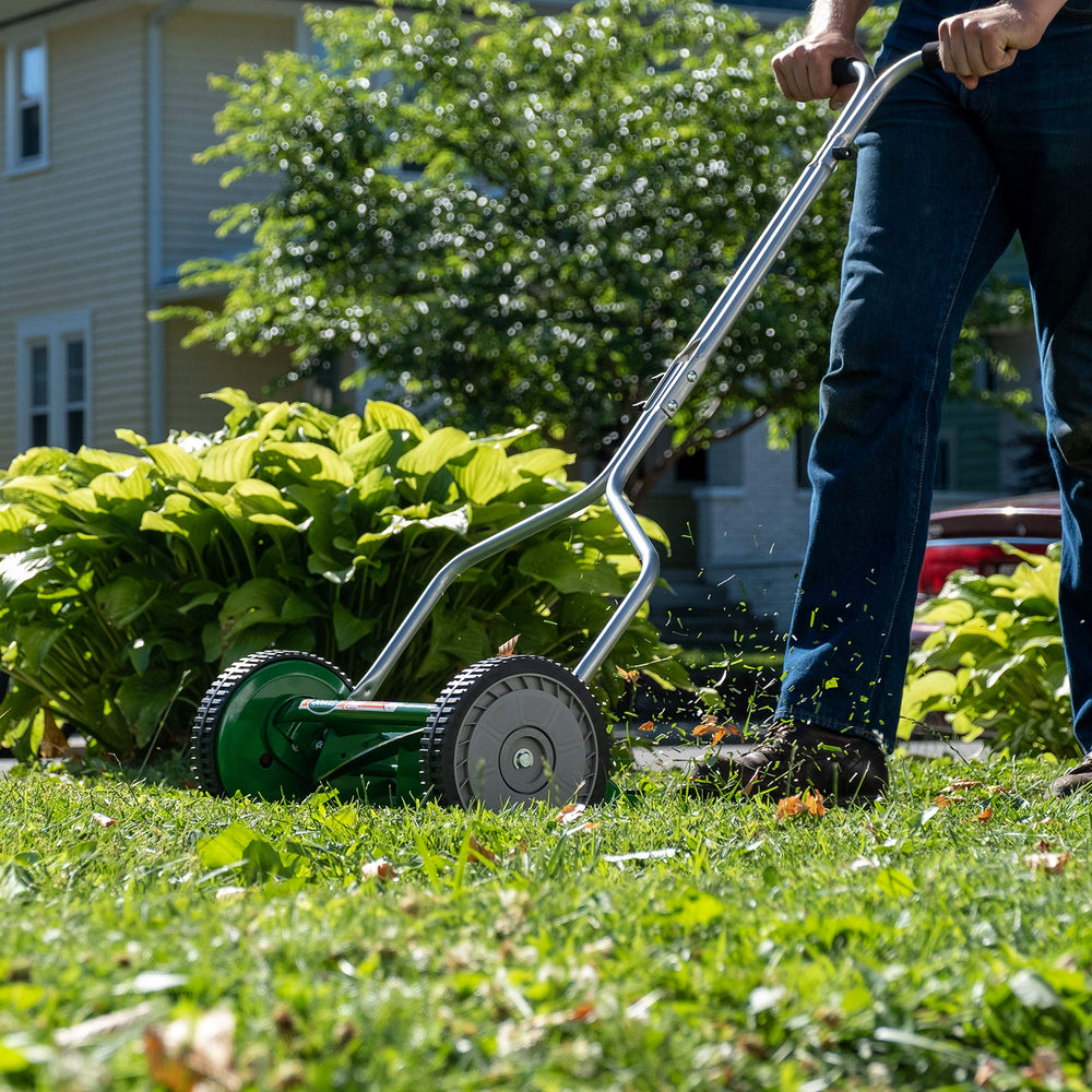 Scotts reel mower in use on maintained lawn demonstrating quiet, emission-free mowing benefit
