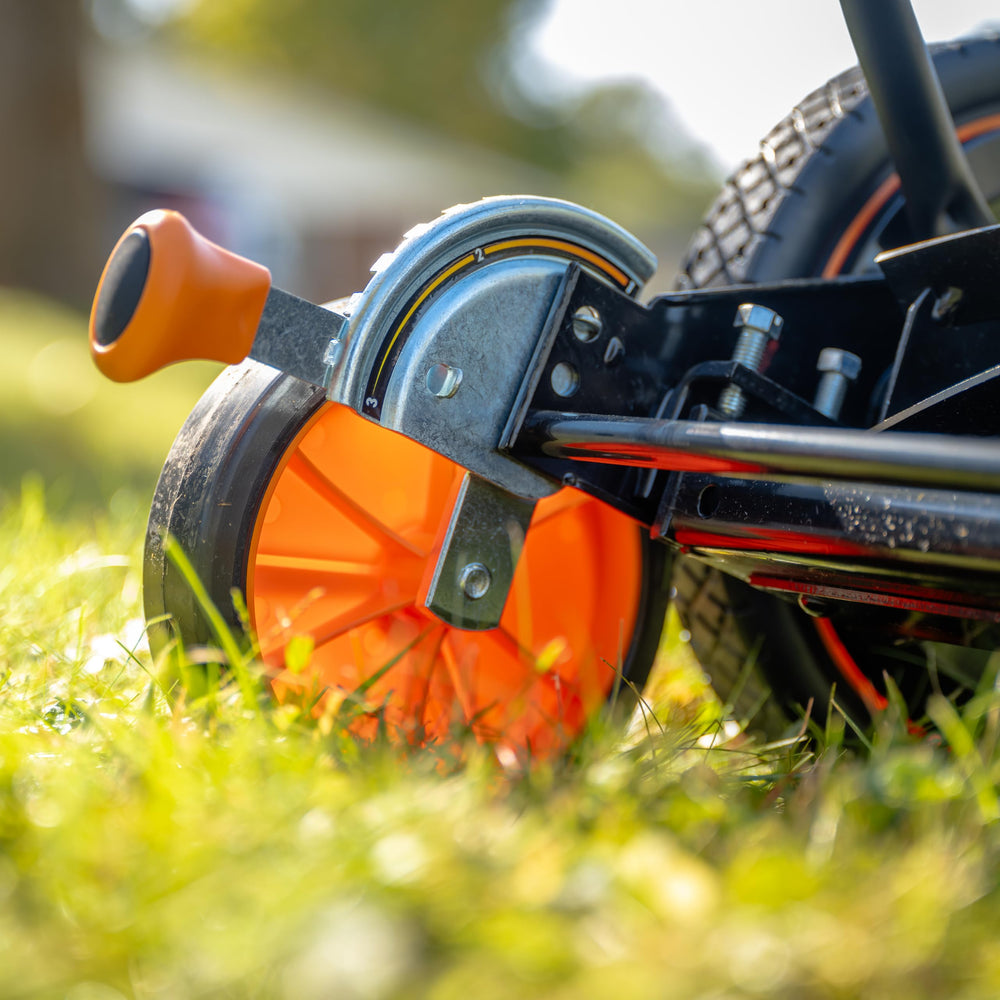 Scotts mower side profile in use on lawn demonstrating quiet operation