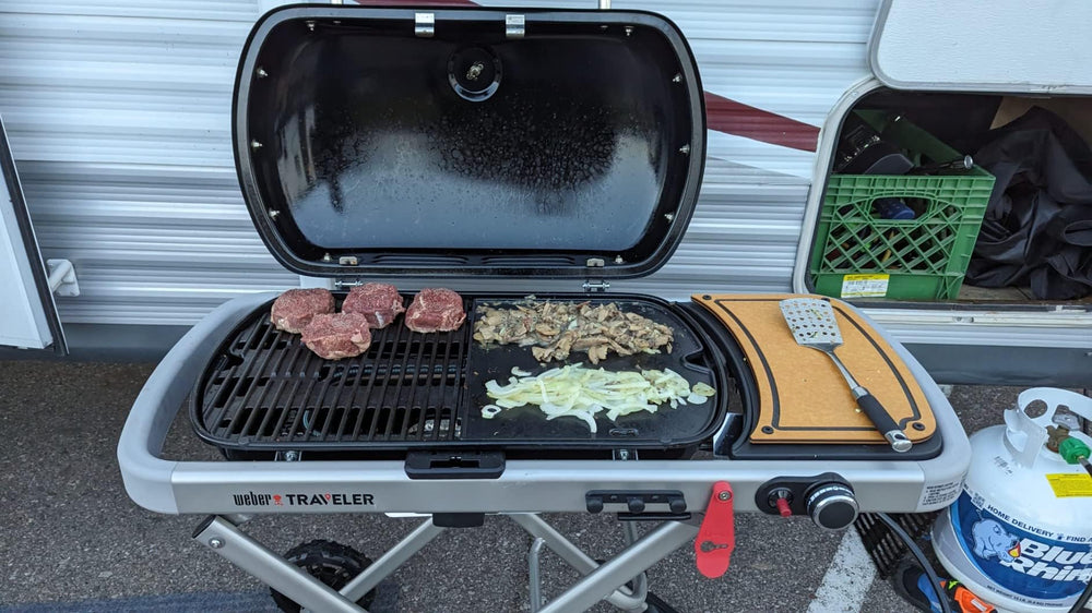 SearCook griddle held in hand for scale showing compact portable benefit