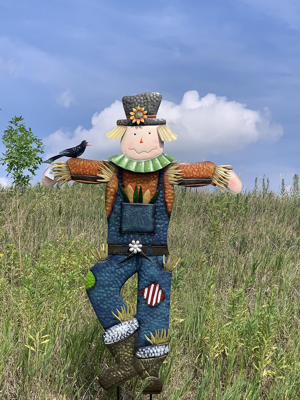Seasonal Expressions scarecrow installed on lawn near porch providing seasonal focal point