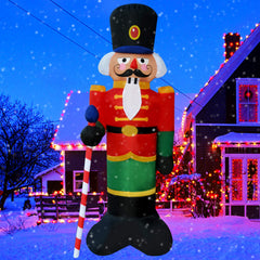 SEASONBLOW front view of 8 ft inflatable nutcracker lighting up yard