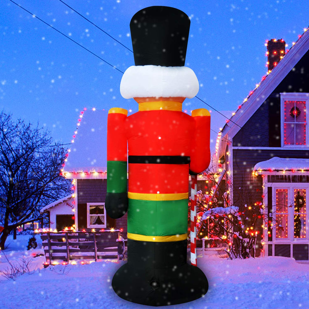 SEASONBLOW inflatable next to house showing eight‑foot size scale