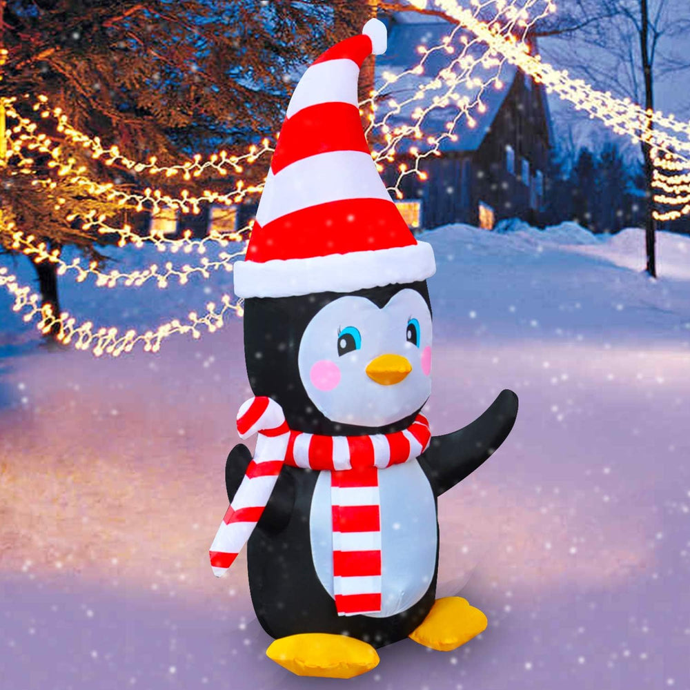SEASONBLOW penguin lit at night providing bright festive yard visibility