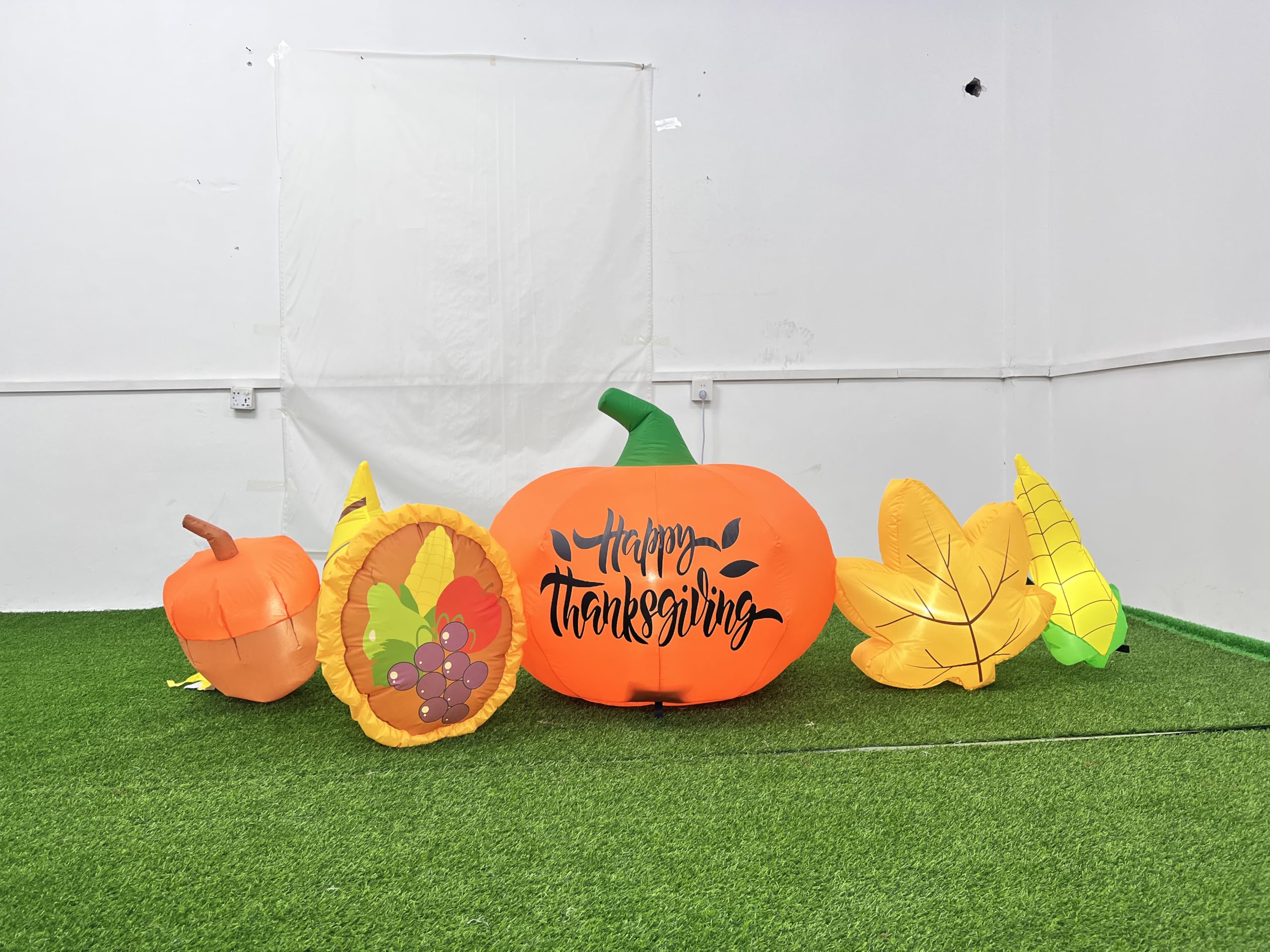 SEASONBLOW front view inflatable pumpkin and cornucopia lit for curb appeal