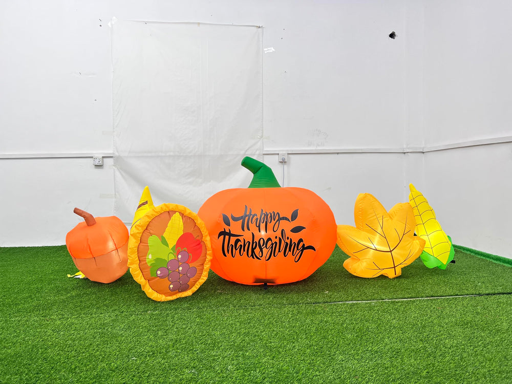 SEASONBLOW front view inflatable pumpkin and cornucopia lit for curb appeal