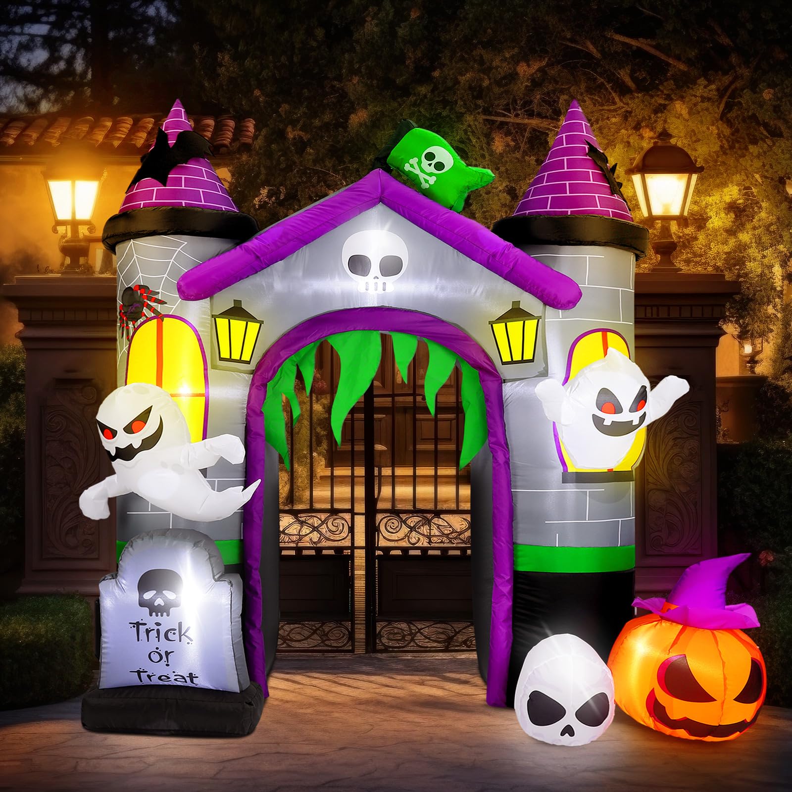Seenelling yard scene at night with glowing arch creating festive curb appeal