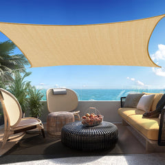SHADESPEARE front view of 16x20 sand shade sail showing clean taut fit and curb appeal