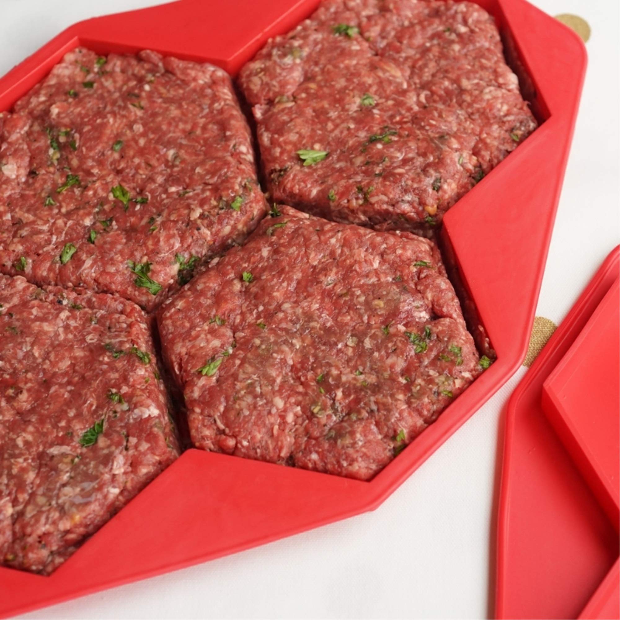 Shape+Store Burger Master MAX front view showing four sealed patty compartments and stackable benefit
