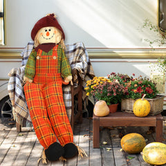 Shappy seated on porch chair showing welcoming fall decoration effect