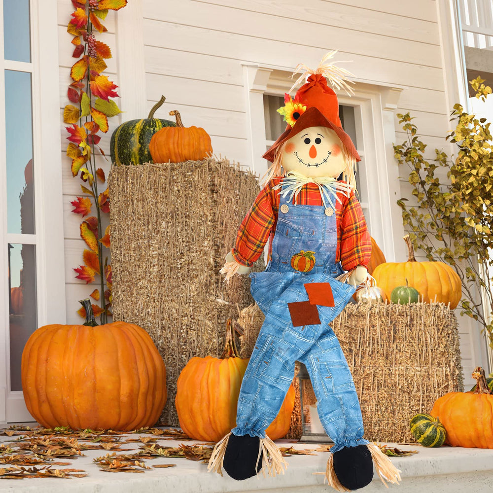 Shappy scarecrow in garden with pumpkins creating festive atmosphere