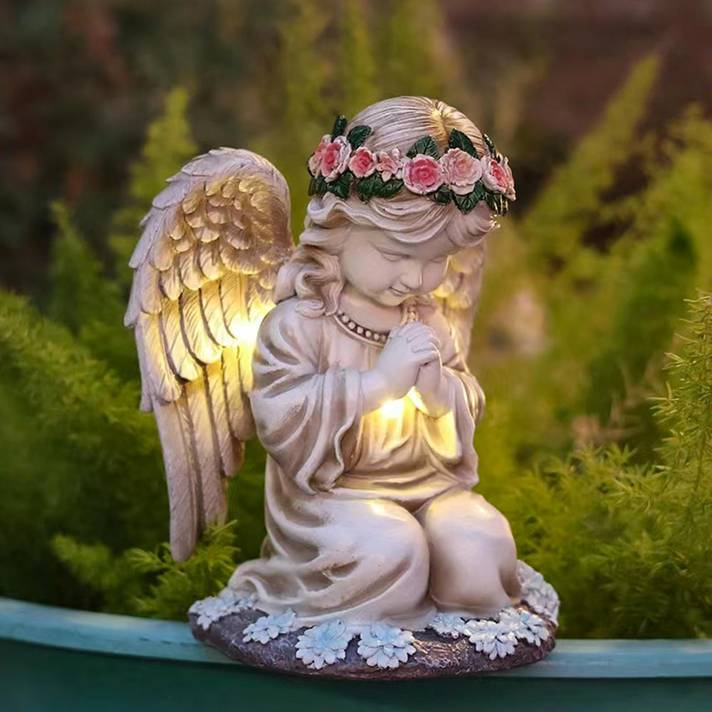 Sharita front view of praying angel statue showing graceful pose and focal glow benefit