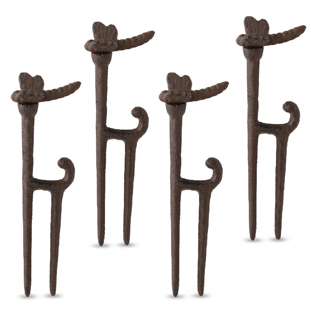 Shimeyao front view of four cast iron hose guide stakes showing rustic finish and dragonfly tops for decorative protection
