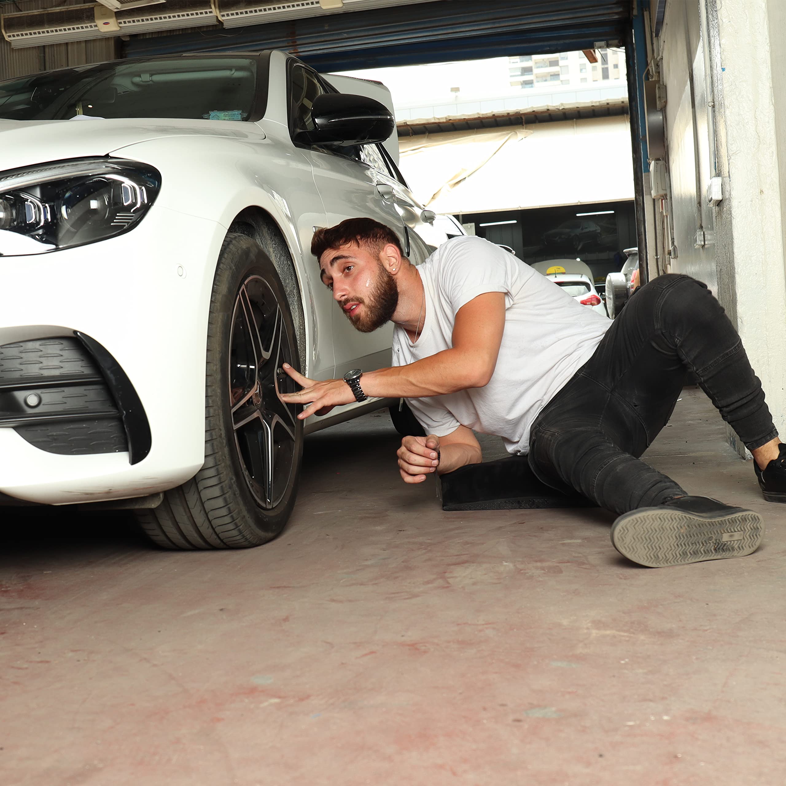 SHINY-V kneeling pad on garage floor aiding mechanics during repairs