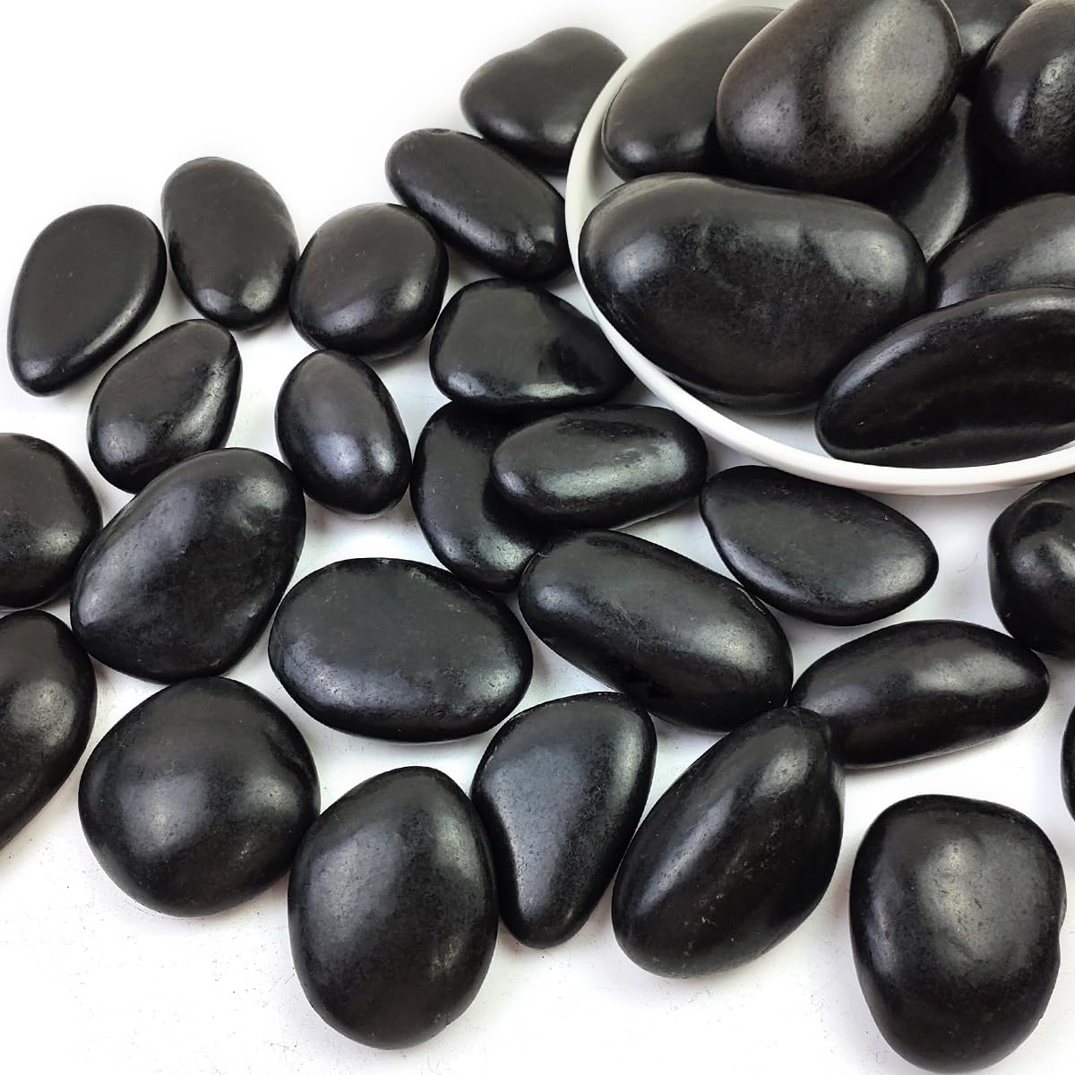 SHIZWU front bag of polished black river rocks showing 20 lb package and convenience