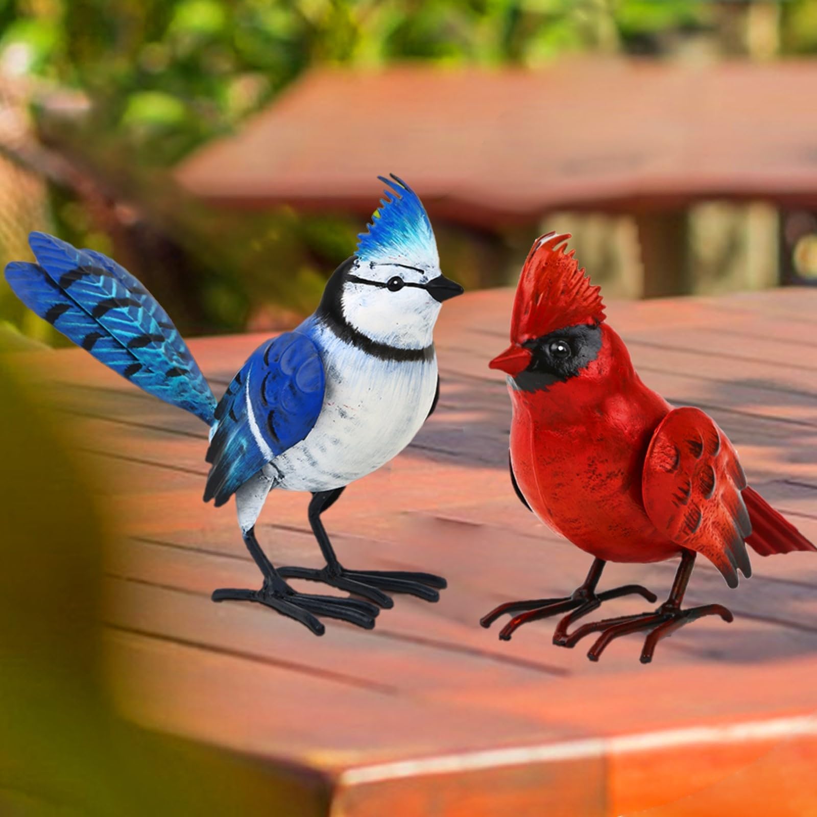 Shorayn front view of both bird statues showing colorful garden charm