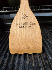 Simply Better Grill Oar removing residue between grates on a hot grill, thorough cleaning