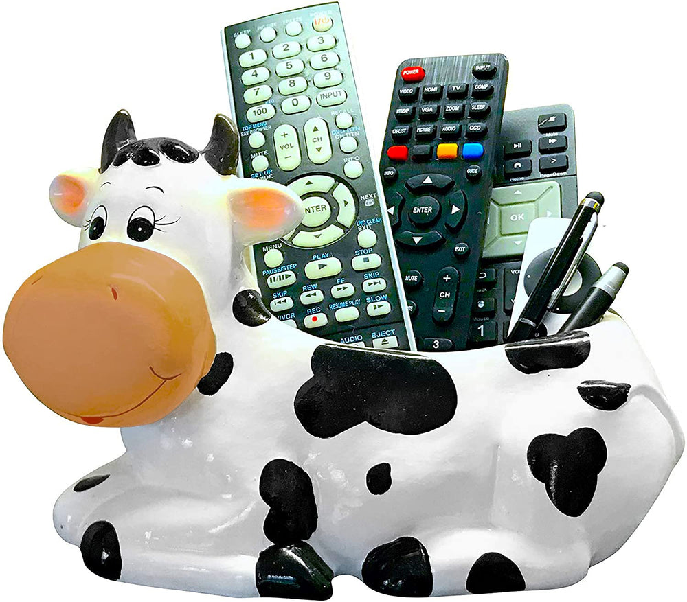 Sixdrop cow planter held in hand showing compact scale and stable weight