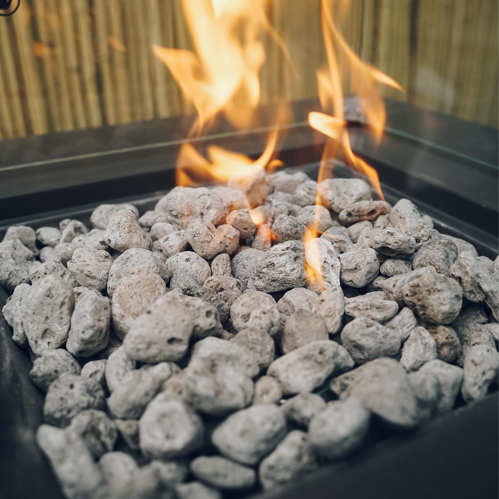 Skyflame lava rocks in a firepit producing even, visible flames and ambiance