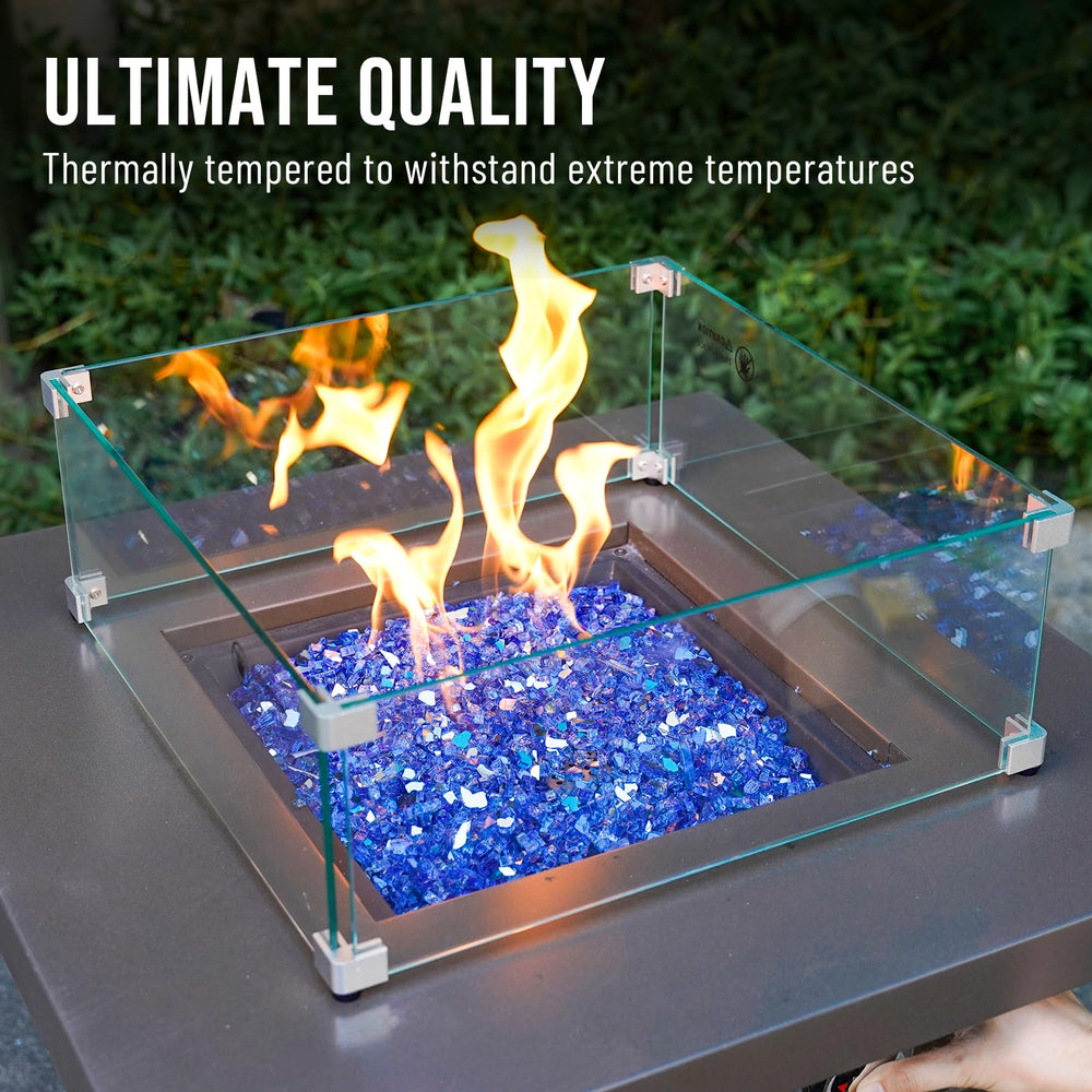 Skyflame in firepit night view with flames above glass creating vibrant blue highlights