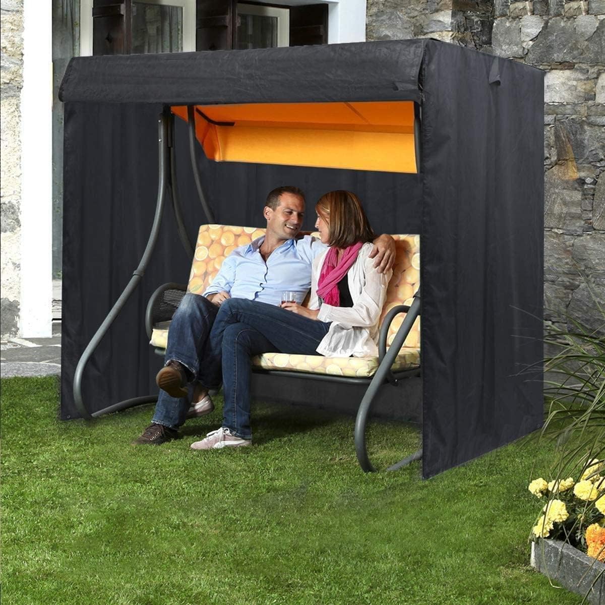 Slan Arrow covered swing beside person for scale showing suitable size fit