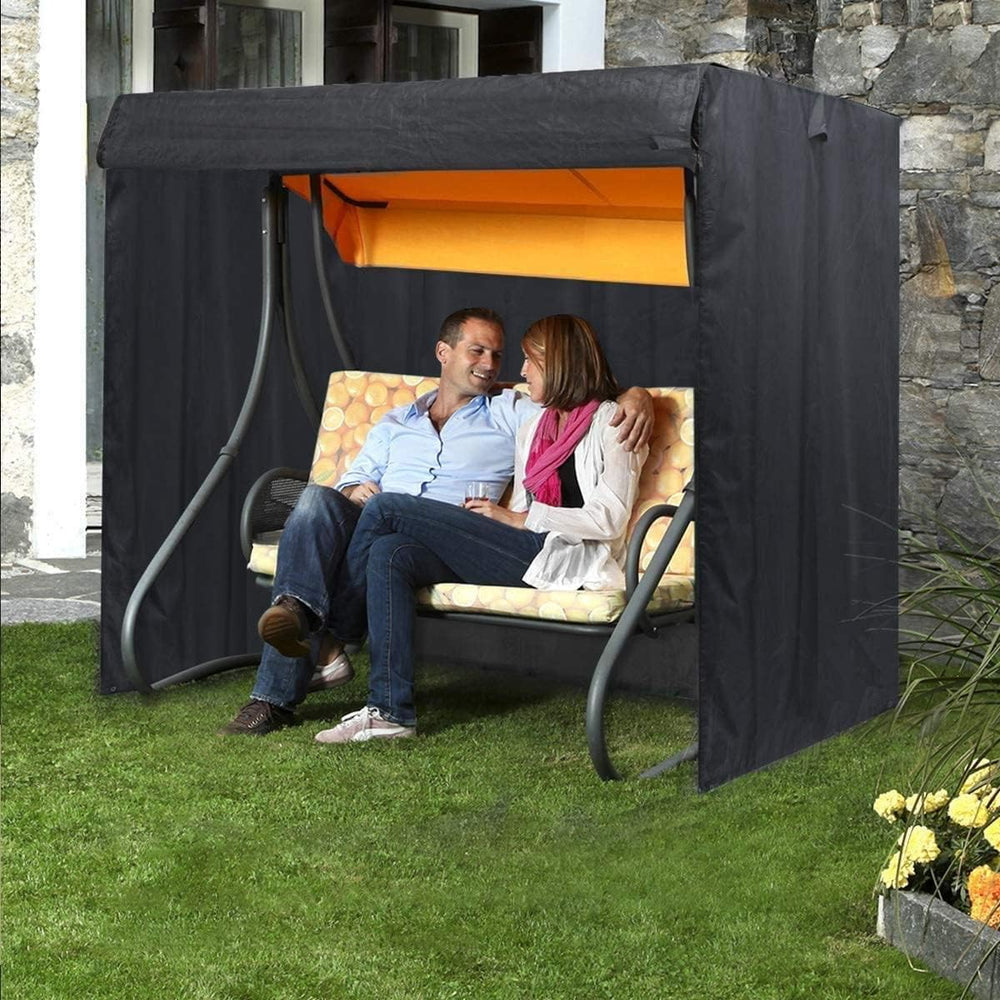 Slan Arrow covered swing beside person for scale showing suitable size fit