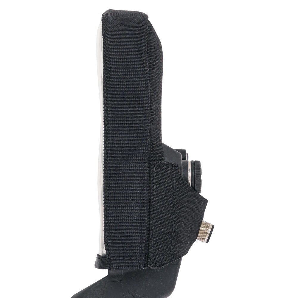 SLY LYNX detail of button and display openings preserving full control access