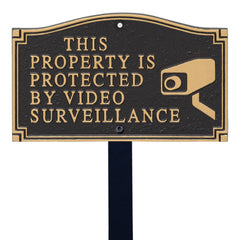 SmartSign front view of black and gold plaque showing clear surveillance message