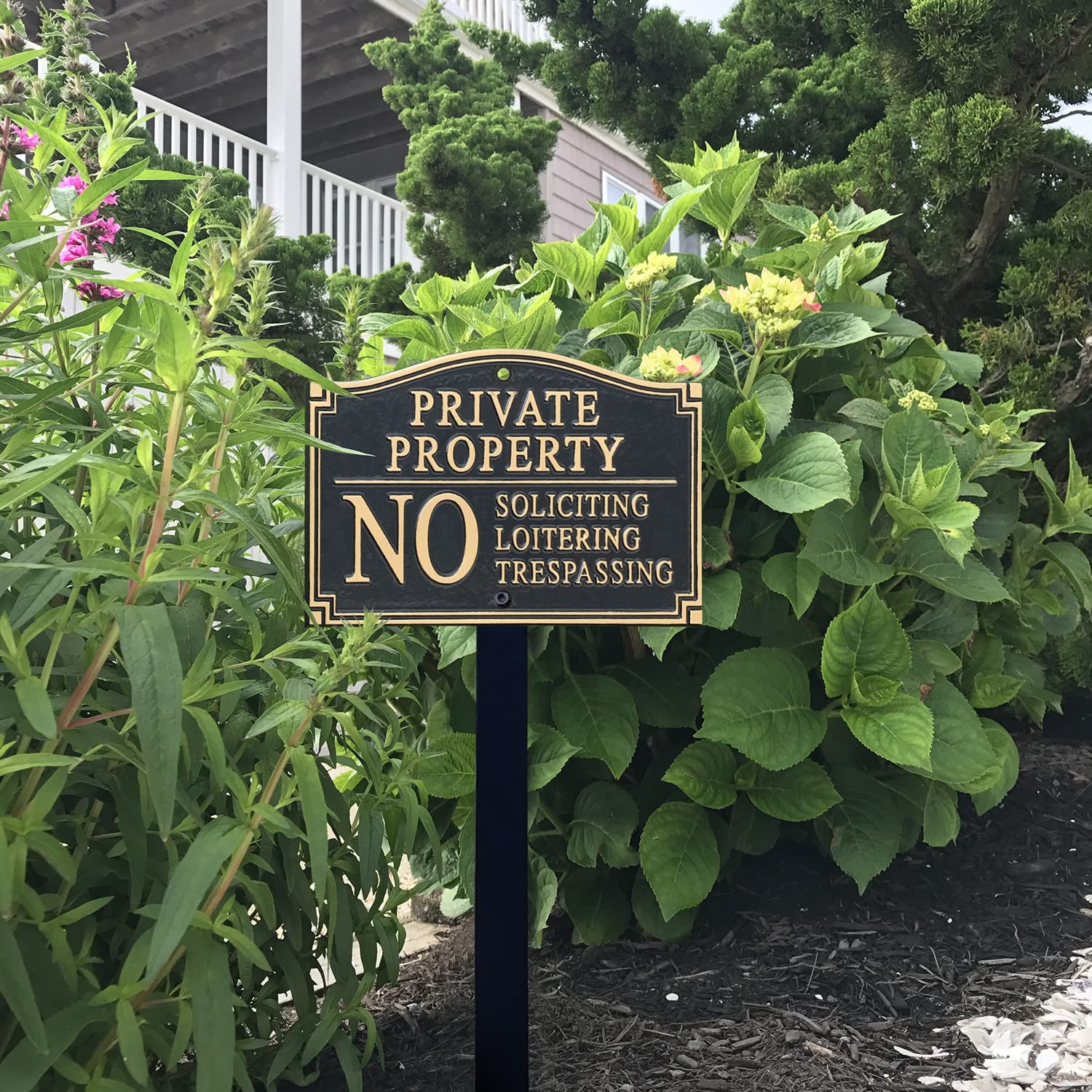 SmartSign lifestyle porch entry showing tasteful placement and visible property boundary