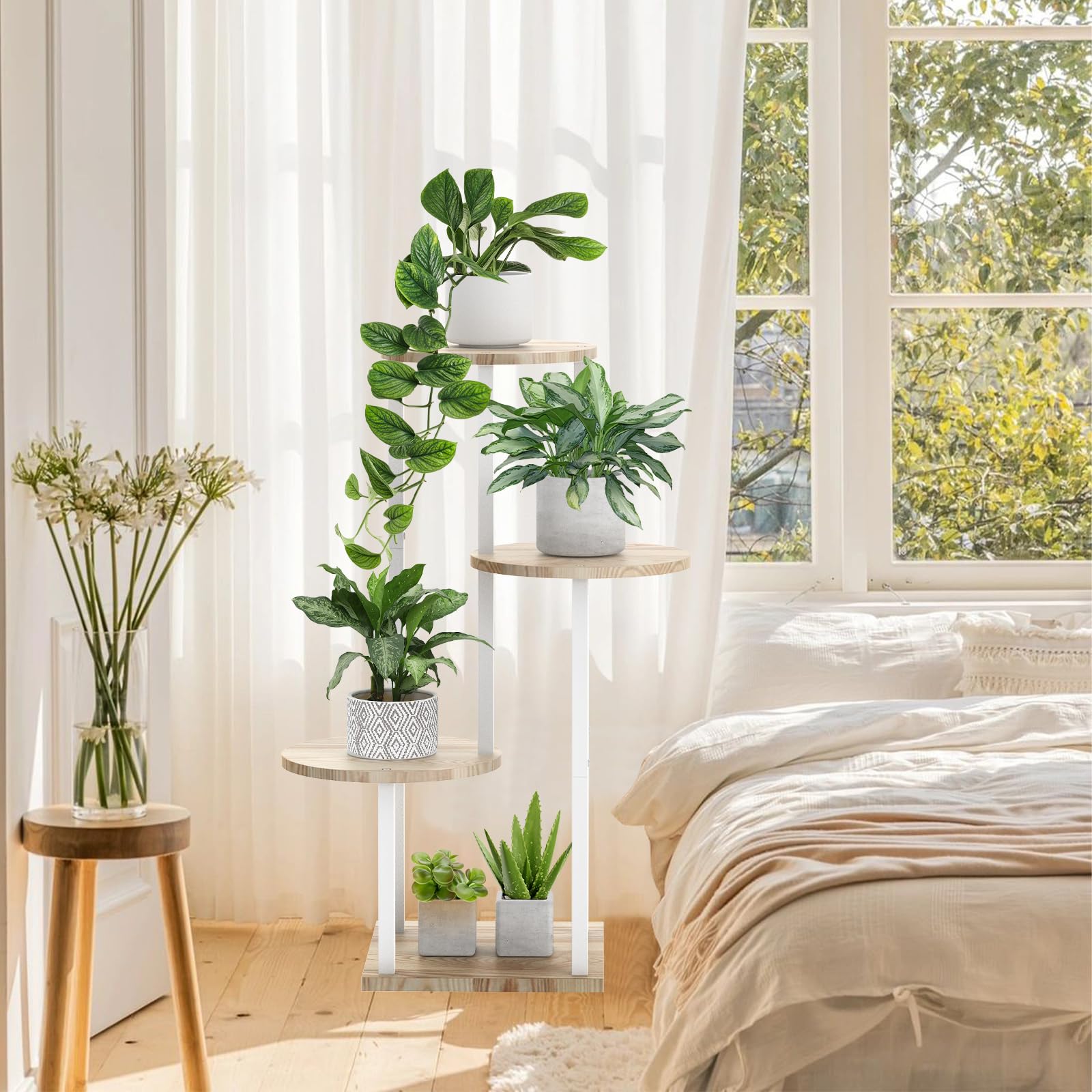 SMFANLIN on balcony with multiple potted plants demonstrating outdoor-suitable design and airflow