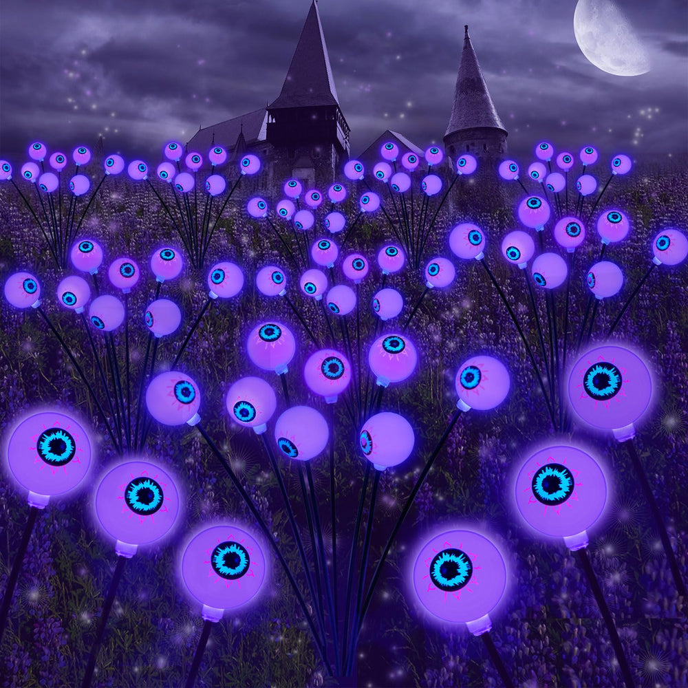SmilingTown front view of purple eyeball stake showing spooky glow and yard benefit