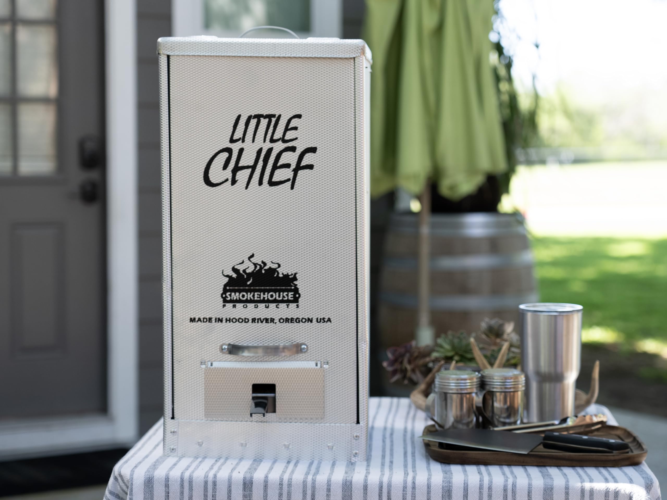 Smokehouse Little Chief interior with racks and drip pan demonstrating organized capacity