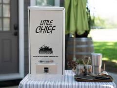 Smokehouse Little Chief interior with racks and drip pan demonstrating organized capacity