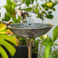 SMQLJXC bird bath next to chair showing scale and visible garden placement