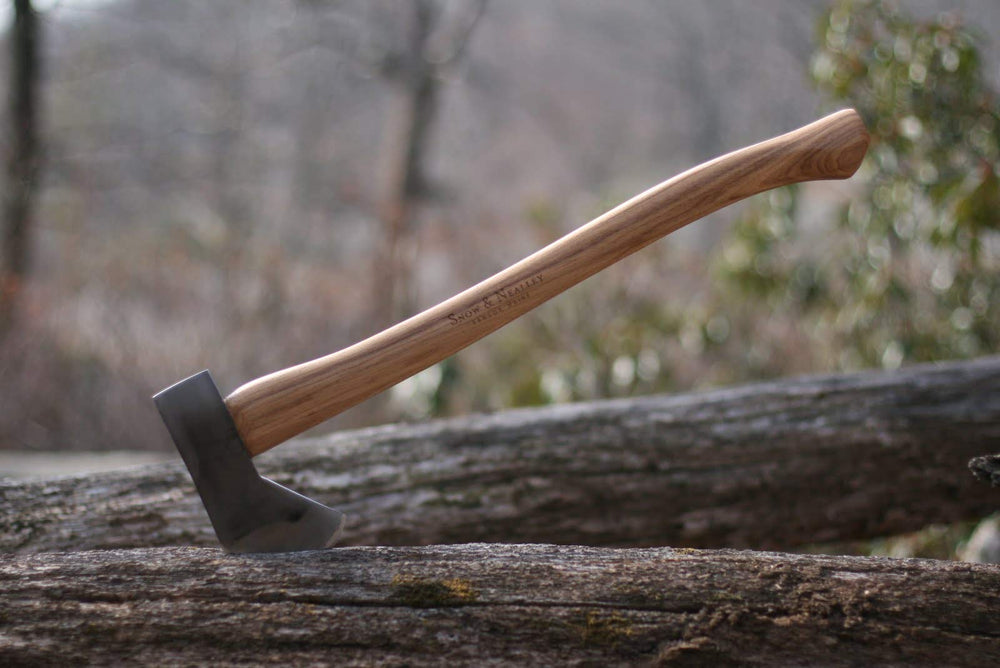 Snow & Nealley axe placed at campsite illustrating portability and practical outdoor use