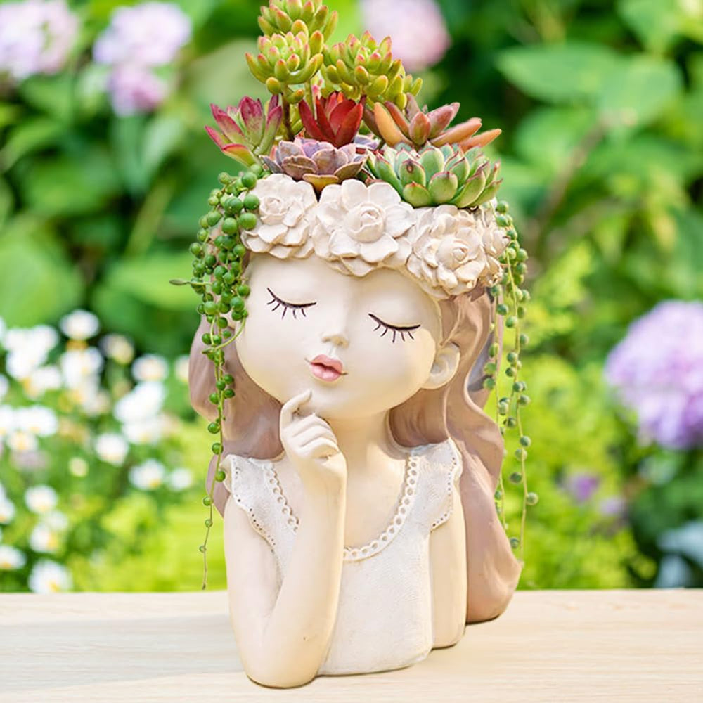 Snowy sunday front view girl-face planter showing sculpted features and stable base