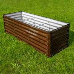 SnugNiture raised bed planted with vegetable rows demonstrating organized harvesting