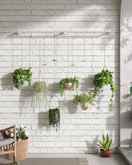 SOFITORG rod installed over window with hanging plants bringing light and space-saving benefit
