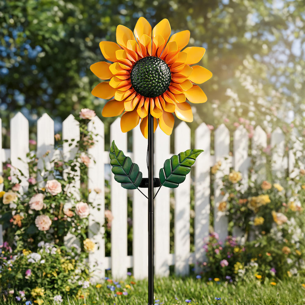 Solgicar sunflower spinner in a garden setting adding visual focal interest