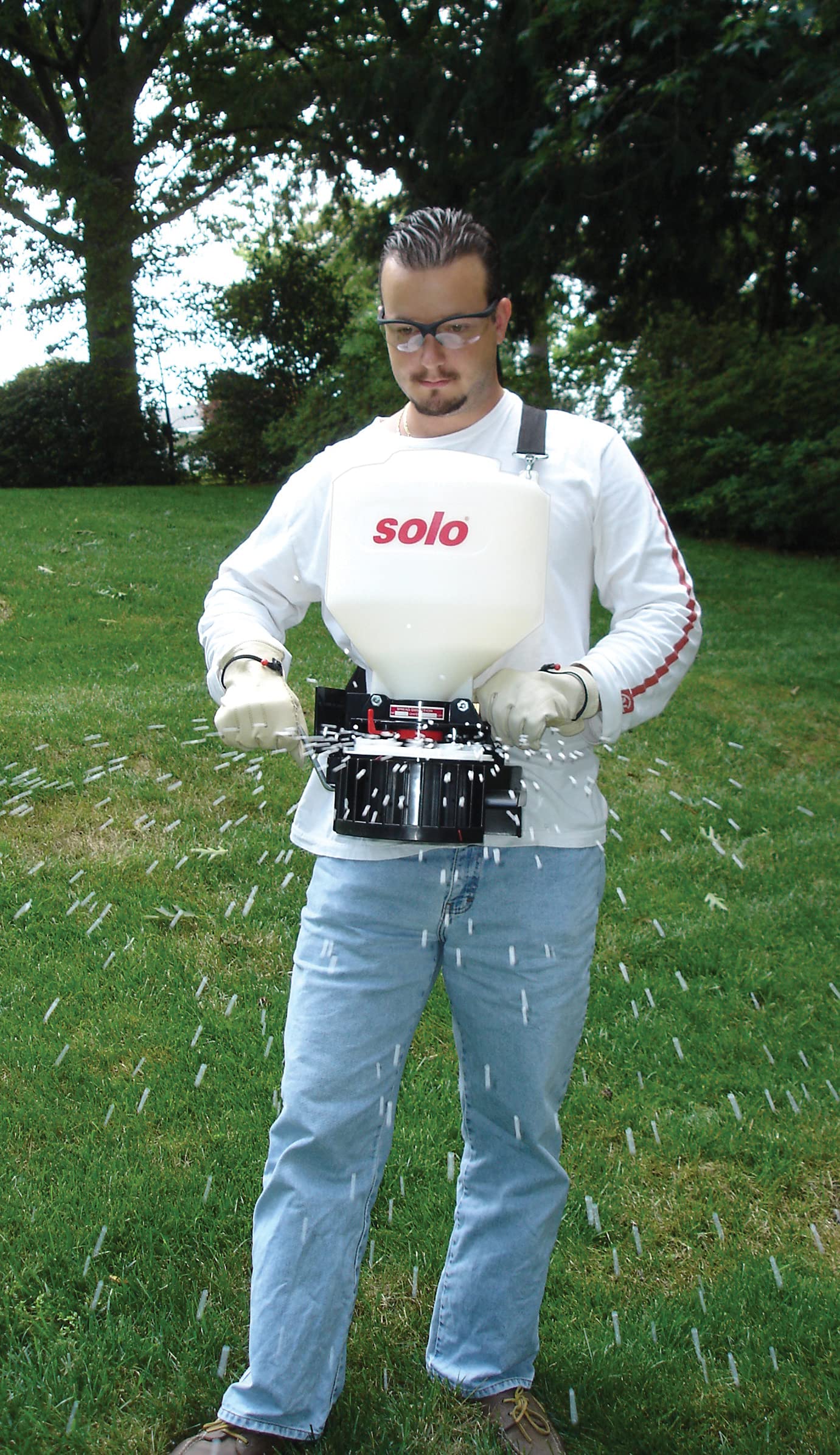 SOLO 421 applying ice melt on sidewalk for safer traction benefit