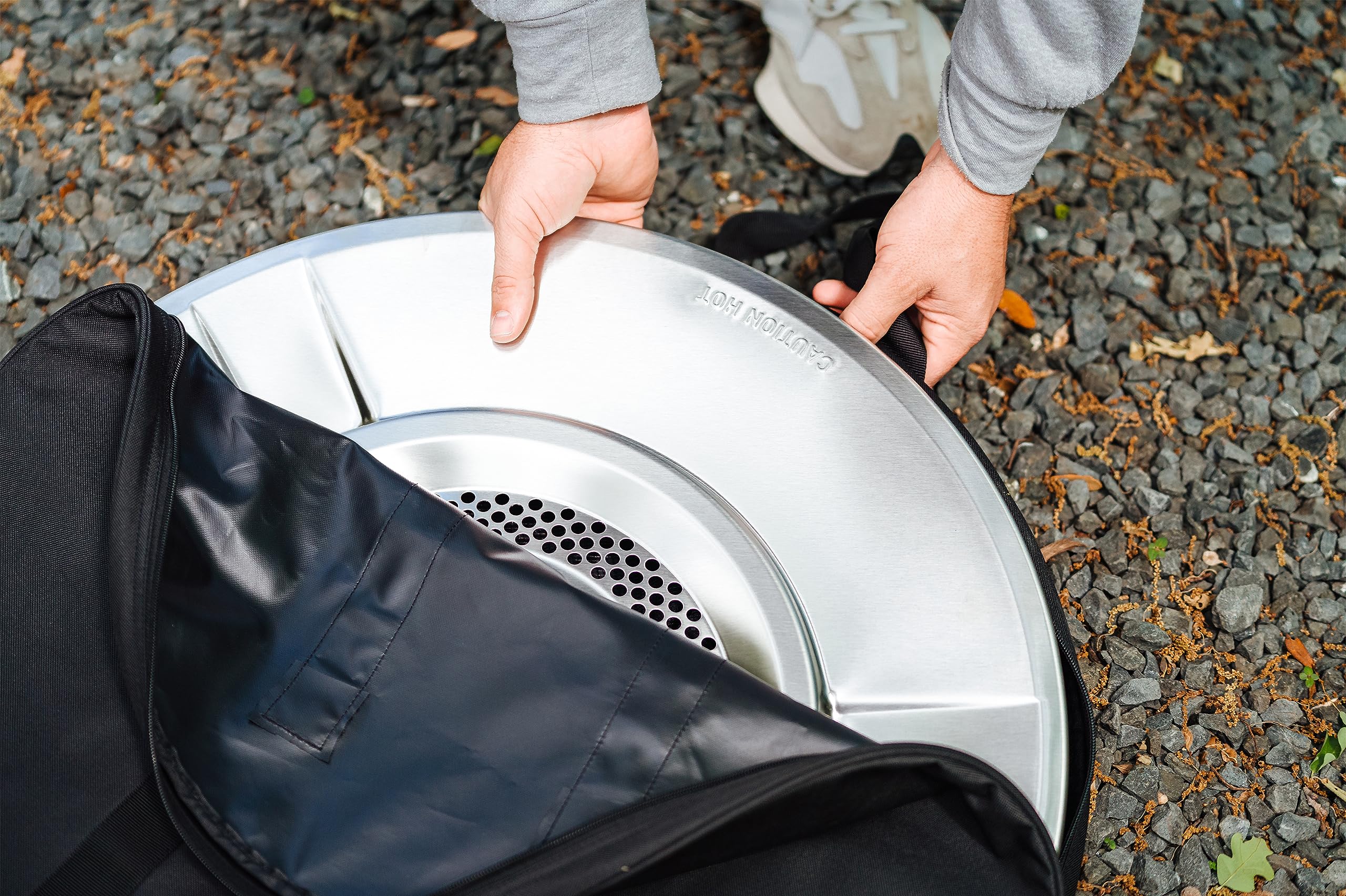 Solo Stove bag beside a backpack for scale and travel-ready convenience benefit