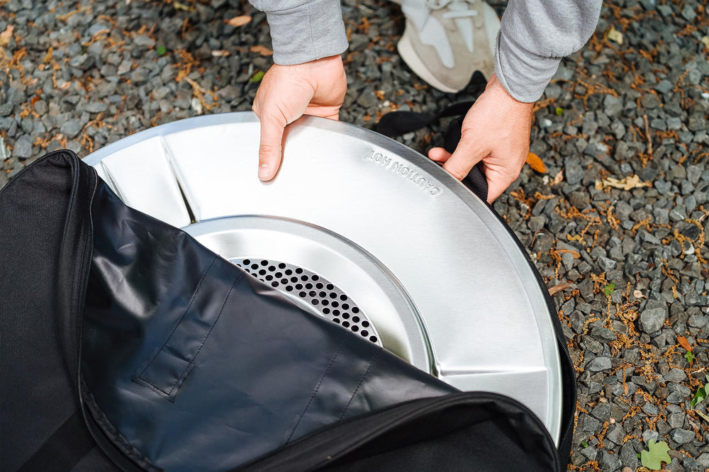 Solo Stove bag next to chair for scale showing 31 inch compatibility
