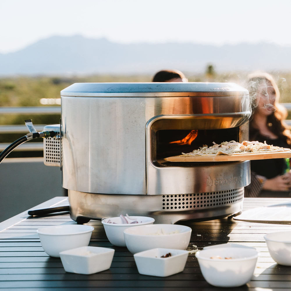 Solo Stove gas burner in outdoor kitchen setting showing reliable cooking benefit