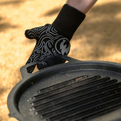 Solo Stove gloves in use with grill tongs demonstrating dexterity